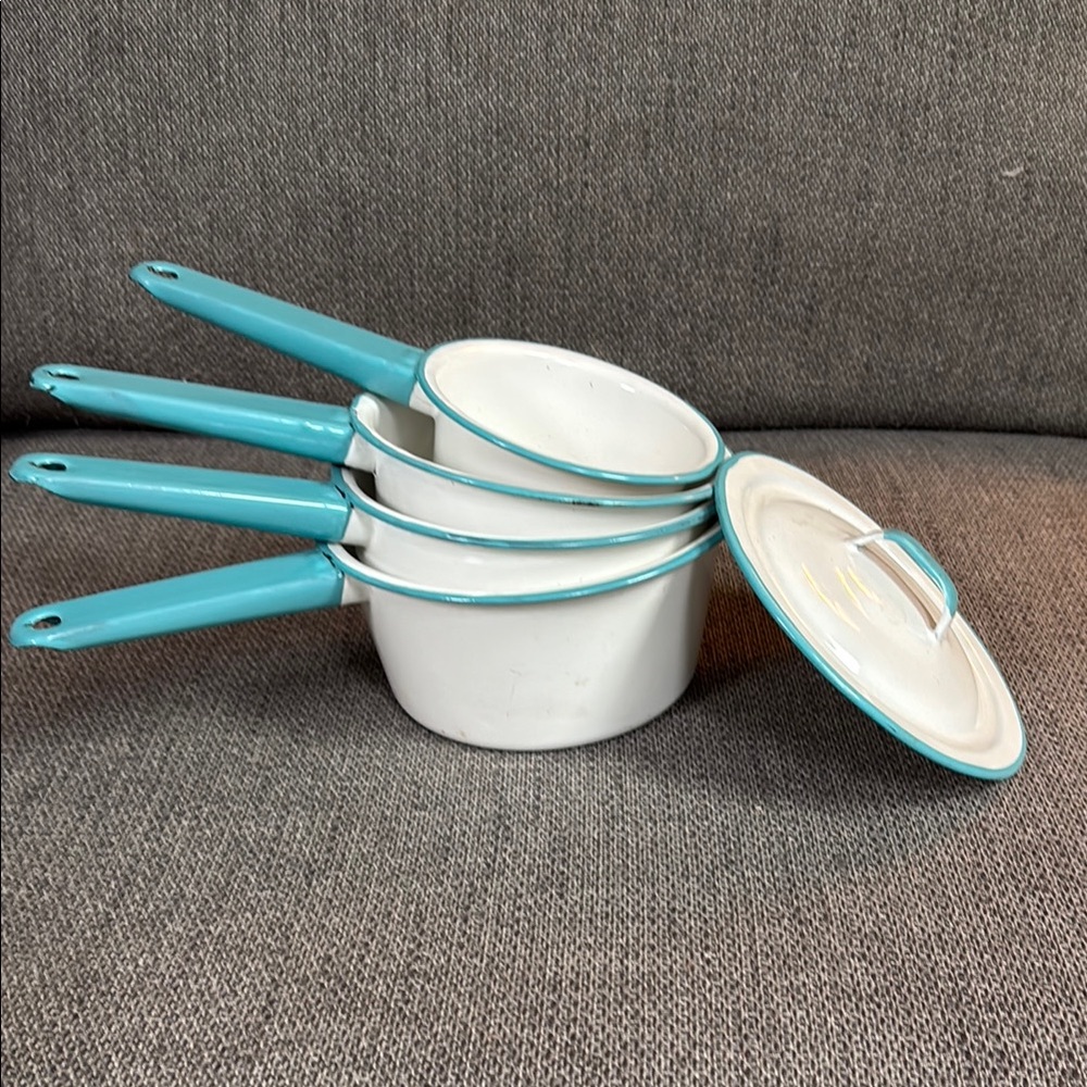 Vintage enamel saucepans set with one lid